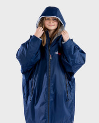 1|Girl wearing Navy Grey dryrobe® Advance Kids Long Sleeve zipped with hood up 
