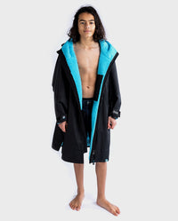 1|Boy wearing Black Blue dryrobe® Advance Kids Long Sleeve unzipped