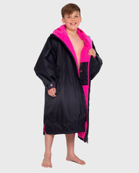 1|Boy wearing Black Pink dryrobe® Advance Kids Long Sleeve 