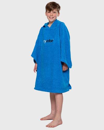 Boy wearing Cobalt Blue Kids Organic Towel poncho