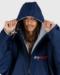 1|Close up of *MALE* wearing Navy Grey dryrobe® Advance Long Sleeve with the hood up