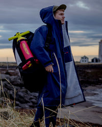 1|*MALE* carrying a bag over his shoulder, while wearing Navy Grey dryrobe® Advance Long Sleeve