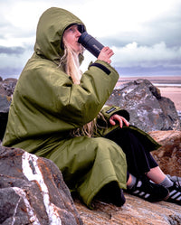 Girl stirring hot drink in a dryrobe® x Ocean Bottle Brew Flask (350ml)